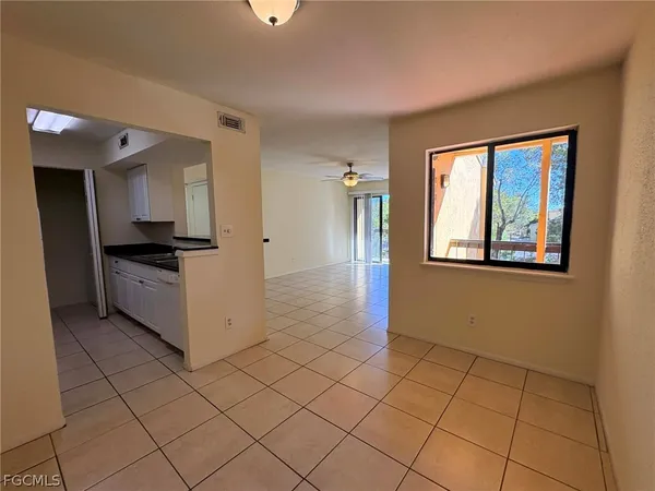 a view of an empty room with a window