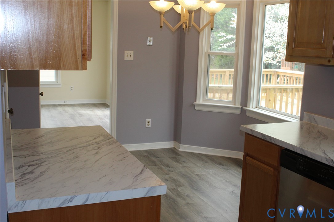 13909 Sagebrook Road Midlothian, VA 23112 - Photo 13 of 41 an empty room with wooden floor and windows