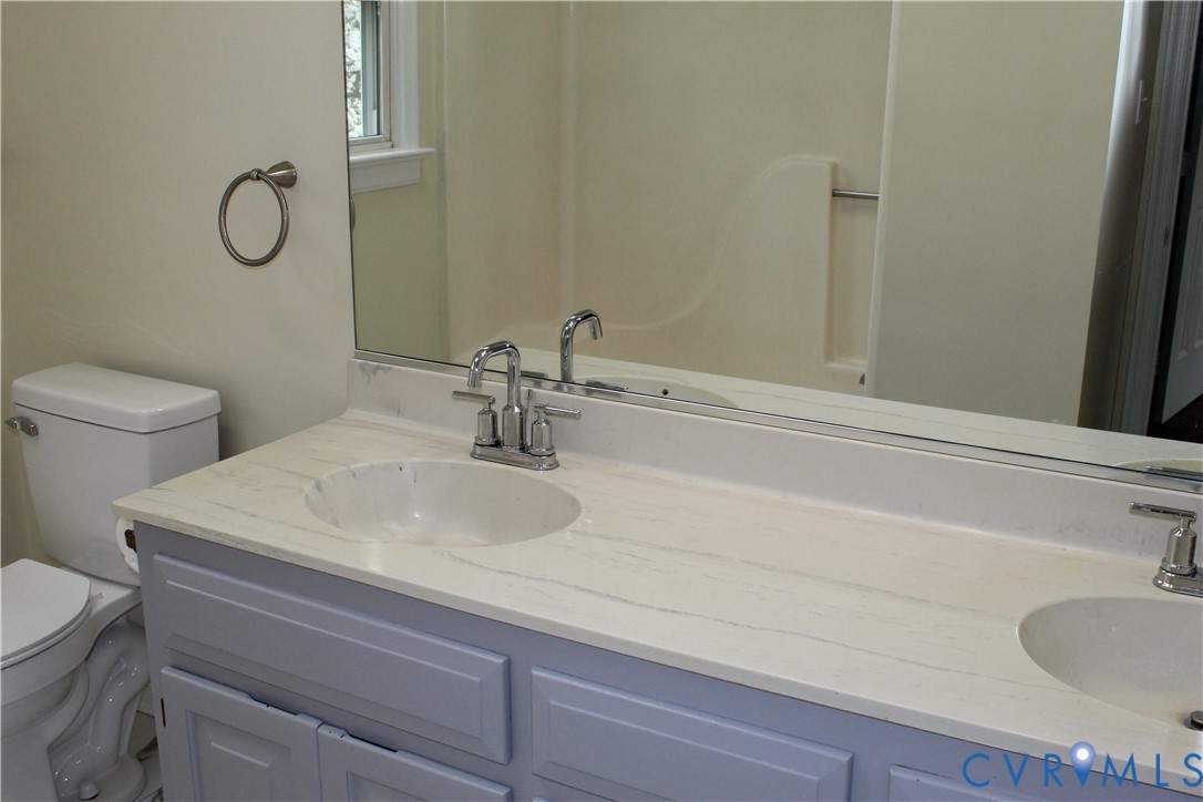13909 Sagebrook Road Midlothian, VA 23112 - Photo 28 of 41 a bathroom with a sink and a toilet