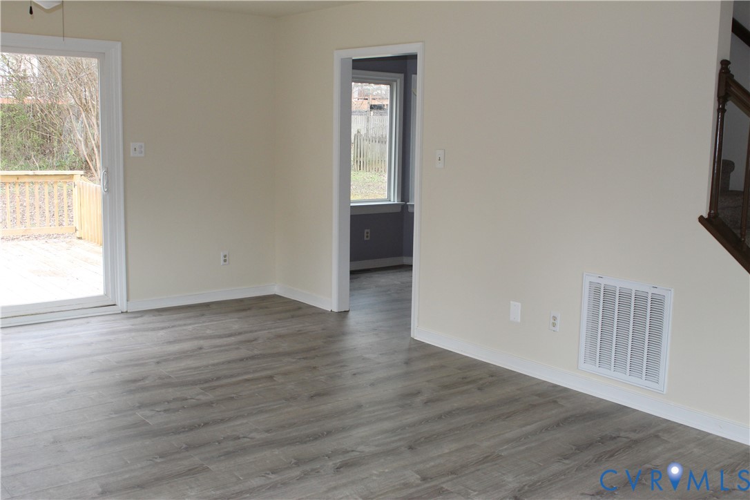13909 Sagebrook Road Midlothian, VA 23112 - Photo 7 of 41 an empty room with wooden floor and windows