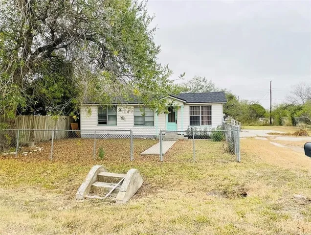 a view of a house with swimming pool and sitting area