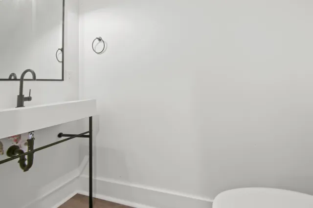 a bathroom with a toilet and a sink