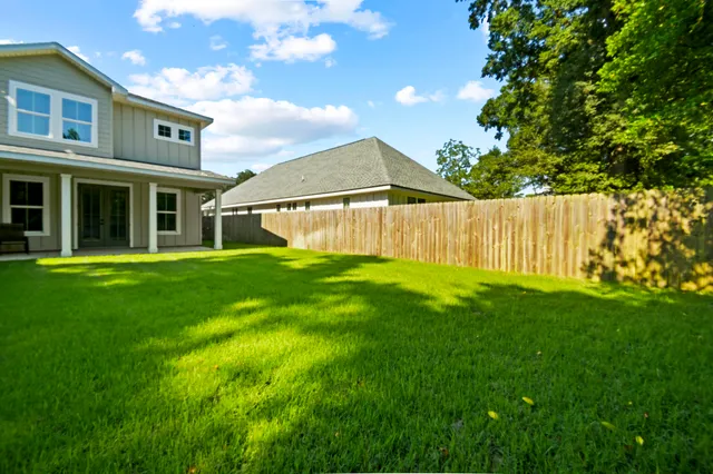 a backyard of a house with lots of green space