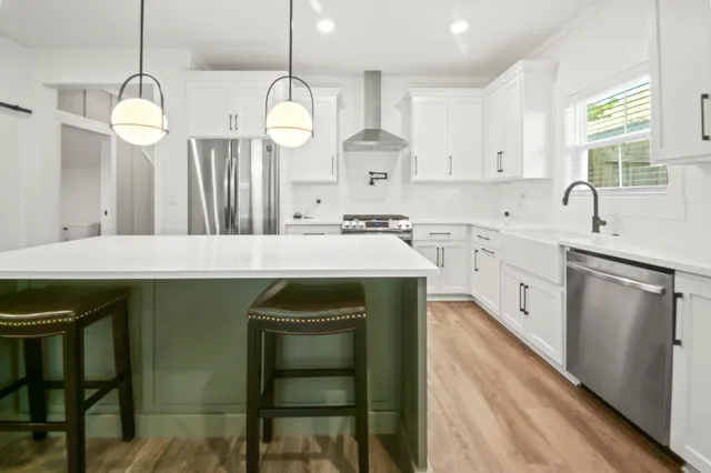 a kitchen with a sink cabinets and window
