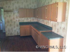 1709 North Canton Road Canton, NC 28716 - Photo 3 of 11 a kitchen with a sink and cabinets