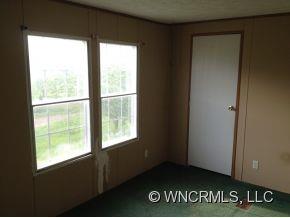 1709 North Canton Road Canton, NC 28716 - Photo 5 of 11 a view of an empty room with stairs