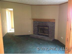 1709 North Canton Road Canton, NC 28716 - Photo 6 of 11 a view of empty room with a fireplace