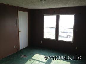 1709 North Canton Road Canton, NC 28716 - Photo 7 of 11 a view of an empty room and window