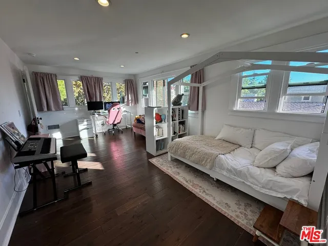 a bathroom with a double vanity sink mirror and shower