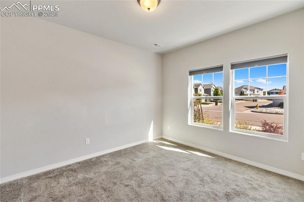10858 Traders Parkway Fountain, CO 80817 - Photo 14 of 38 an empty room with windows