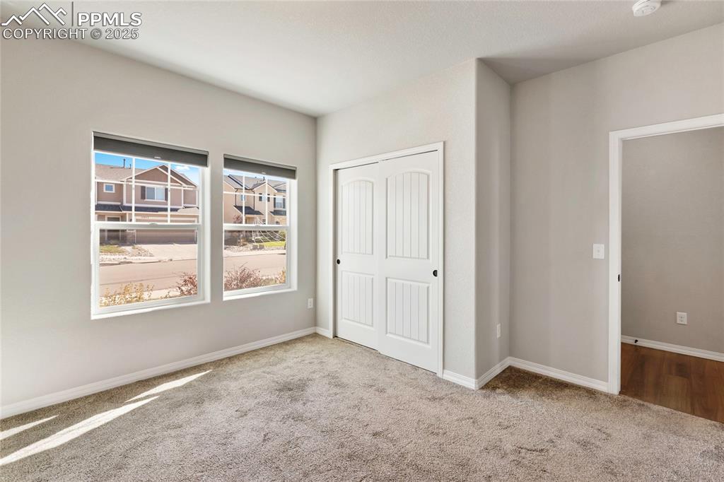 10858 Traders Parkway Fountain, CO 80817 - Photo 15 of 38 an empty room with windows