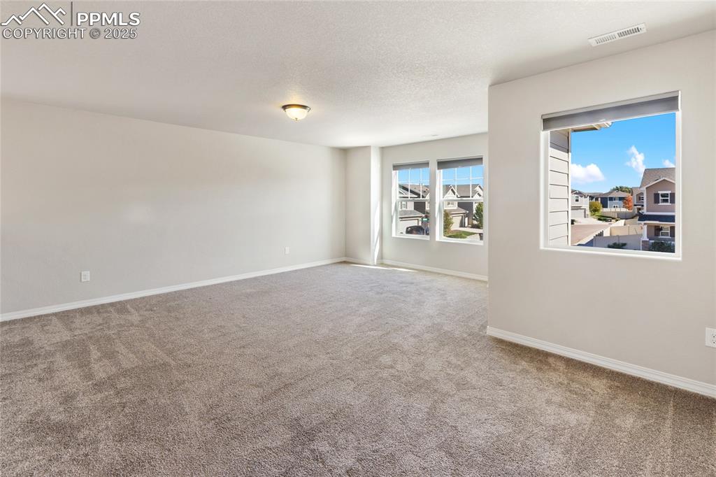 10858 Traders Parkway Fountain, CO 80817 - Photo 17 of 38 a view of an empty room with a window