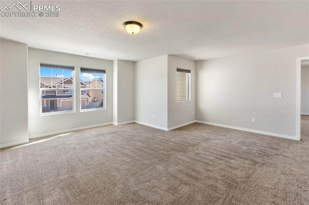 10858 Traders Parkway Fountain, CO 80817 - Photo 18 of 38 a view of an empty room with a window