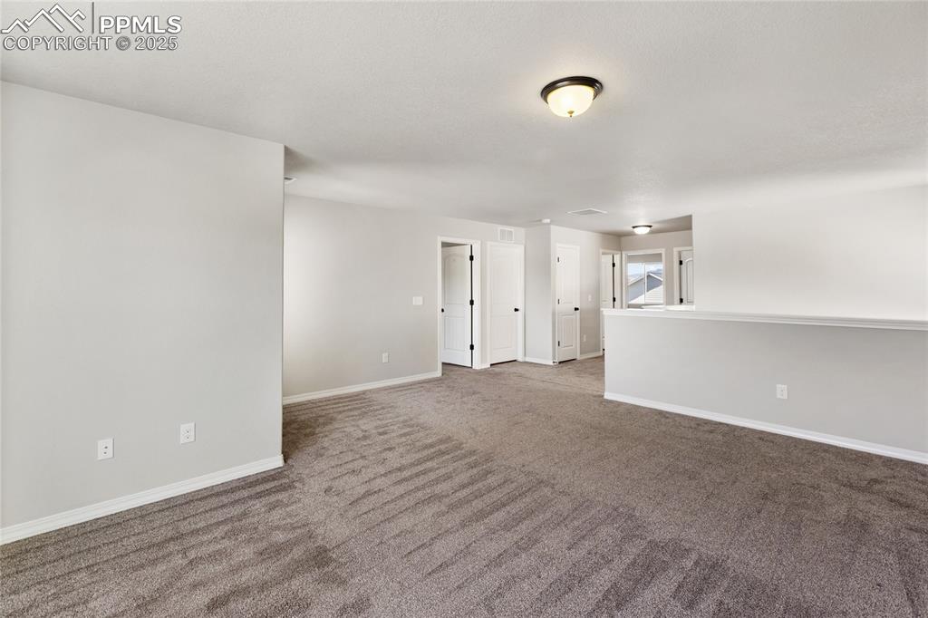 10858 Traders Parkway Fountain, CO 80817 - Photo 19 of 38 a view of empty room with wooden floor