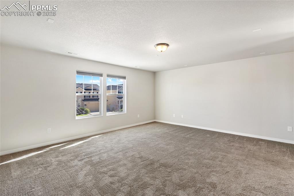 10858 Traders Parkway Fountain, CO 80817 - Photo 21 of 38 an empty room with a window