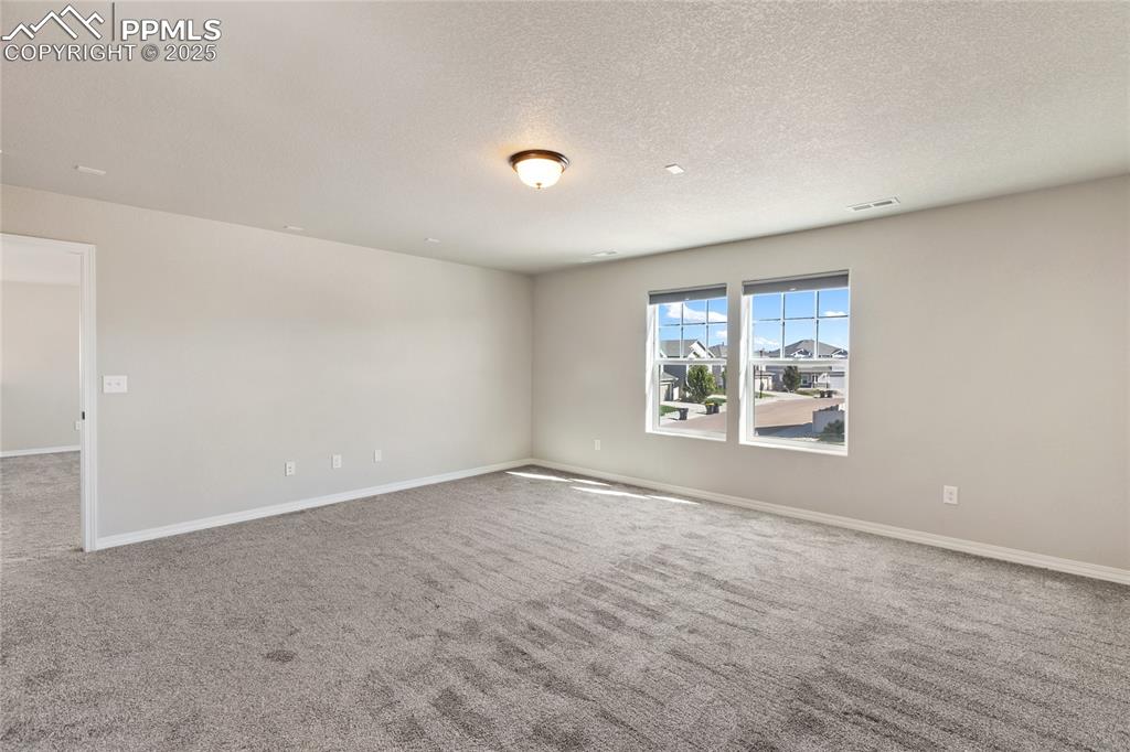 10858 Traders Parkway Fountain, CO 80817 - Photo 23 of 38 an empty room with windows