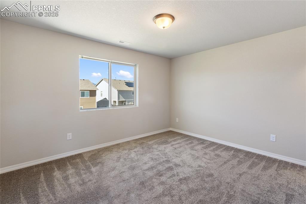 10858 Traders Parkway Fountain, CO 80817 - Photo 29 of 38 an empty room with windows