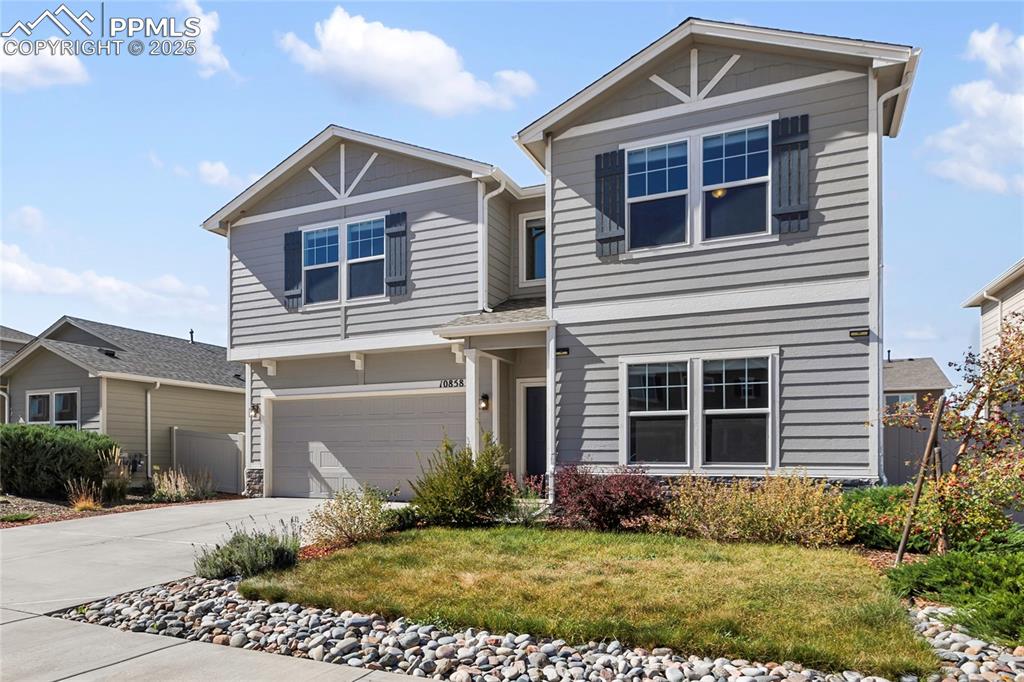 10858 Traders Parkway Fountain, CO 80817 - Photo 3 of 38 a front view of a house with a yard