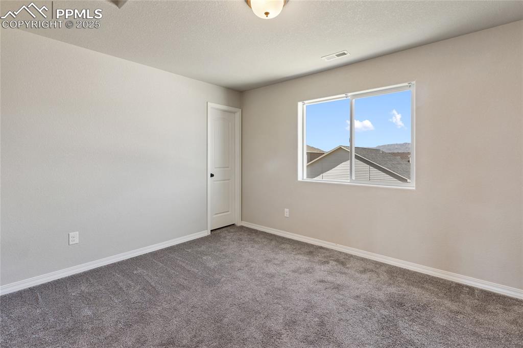 10858 Traders Parkway Fountain, CO 80817 - Photo 35 of 38 an empty room with windows