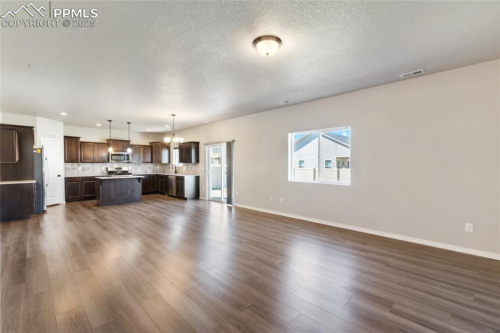 10858 Traders Parkway Fountain, CO 80817 - Photo 10 of 38 a view of kitchen with furniture and wooden floor