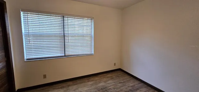 a view of a room that has a window in it