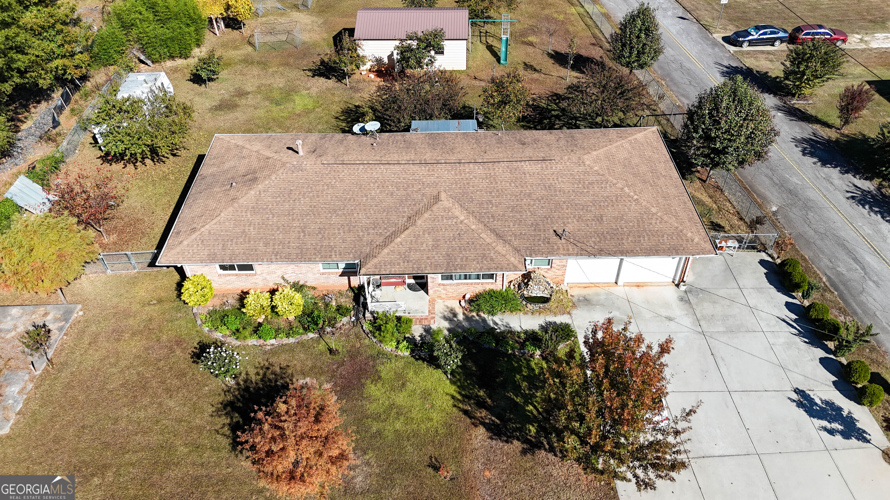 6410 Highway 42 Rex, GA 30273 - Photo 1 of 1 an aerial view of a house with a yard and a large tree
