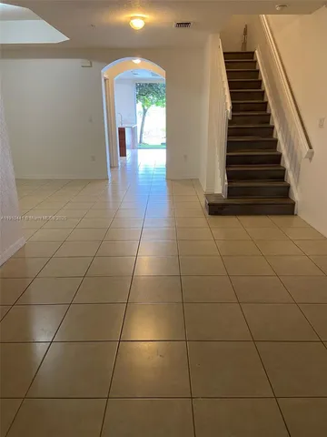 a view of a livingroom with wooden floor and entertaining space