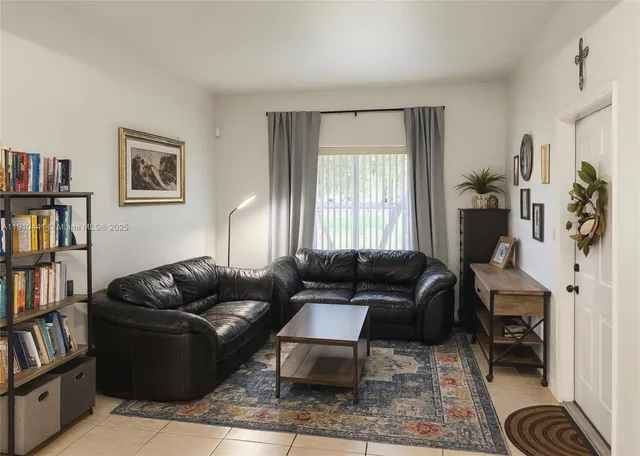 a living room with furniture and a window