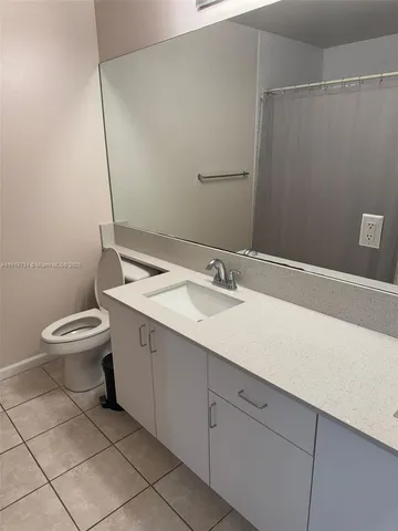 a bathroom with a sink toilet and vanity