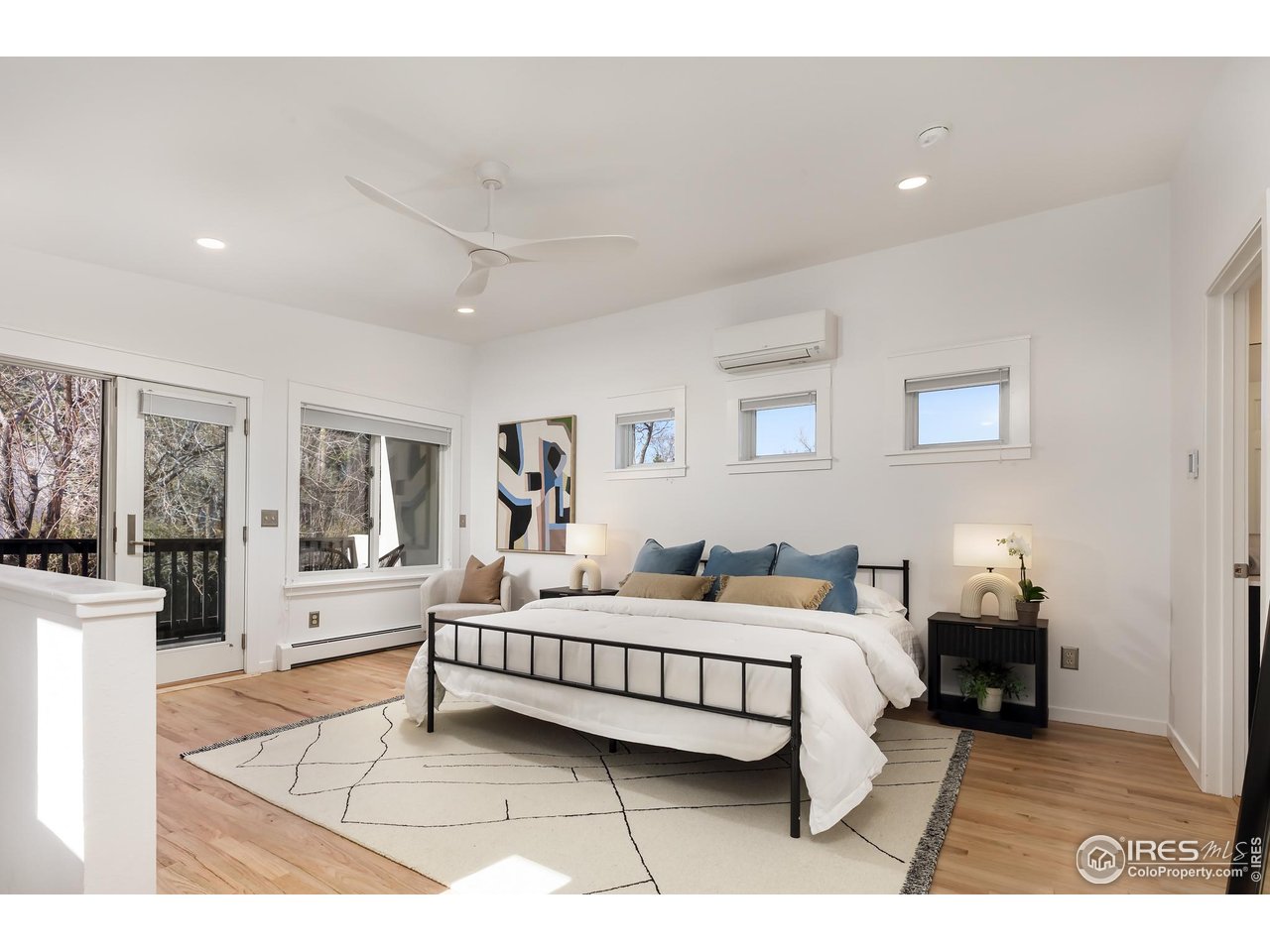 751 Grant Place Boulder, CO 80302 - Photo 22 of 38 Expansive owner's suite with French doors opening to a large balcony overlooking the Flatirons and the landscaped yard below.