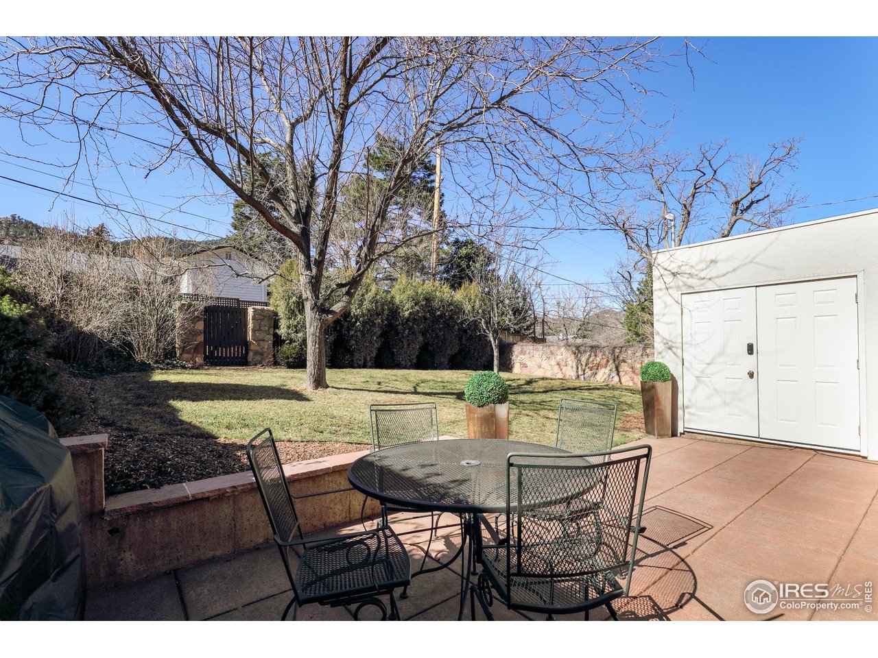 751 Grant Place Boulder, CO 80302 - Photo 32 of 38 Beautifully designed landscape, with fully sprinkler watering system front and back yards framed by handsome stonework and redwood fencing.