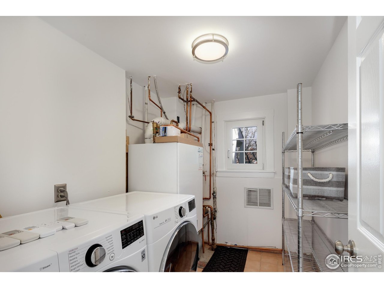 751 Grant Place Boulder, CO 80302 - Photo 33 of 38 Large laundry room/ utility room with a newer LG washer and dryer.