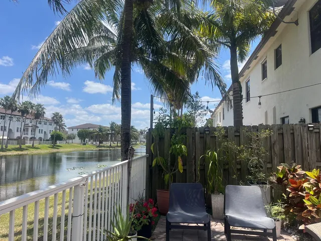 a view of a lake with a bench next to a lake