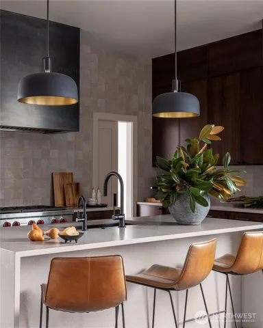 a kitchen with a table and chairs in it