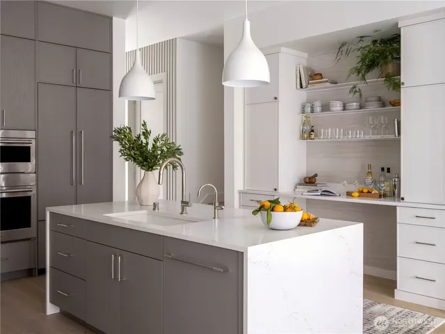 a bathroom with a sink double vanity and a mirror