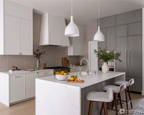 a kitchen with a sink a stove and cabinets