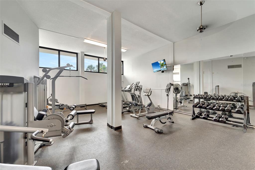 5855 Midnight Pass Road, Unit 314 Sarasota, FL 34242 - Photo 11 of 58 a view of a room with gym equipment