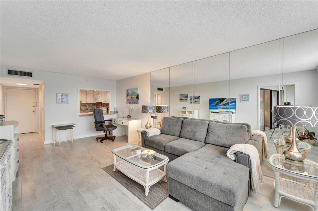 5855 Midnight Pass Road, Unit 314 Sarasota, FL 34242 - Photo 14 of 58 a living room with furniture kitchen view and a table