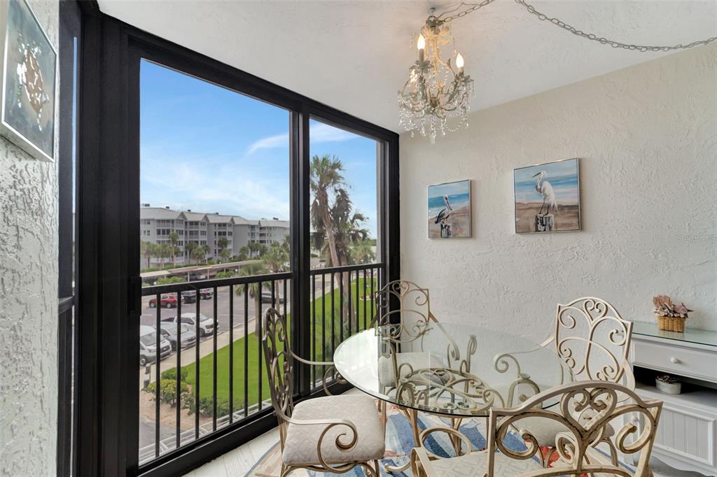 5855 Midnight Pass Road, Unit 314 Sarasota, FL 34242 - Photo 27 of 58 a living room with furniture and a window