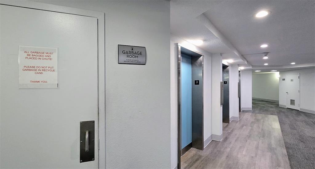 5855 Midnight Pass Road, Unit 314 Sarasota, FL 34242 - Photo 32 of 58 a view of a hallway with wooden floor
