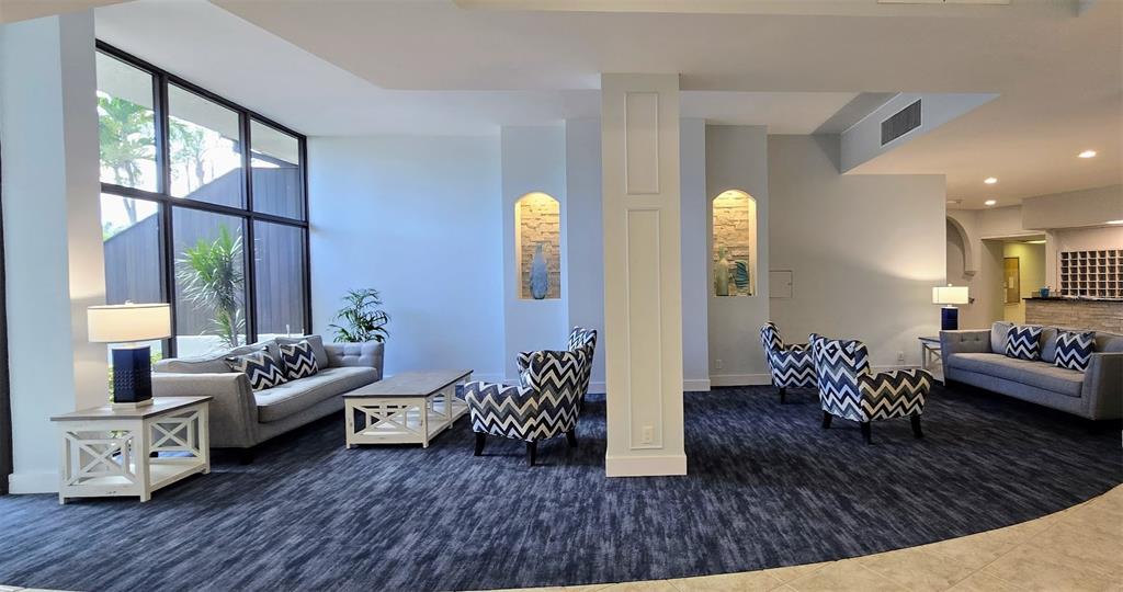 5855 Midnight Pass Road, Unit 314 Sarasota, FL 34242 - Photo 36 of 58 a living room with furniture and wooden floor