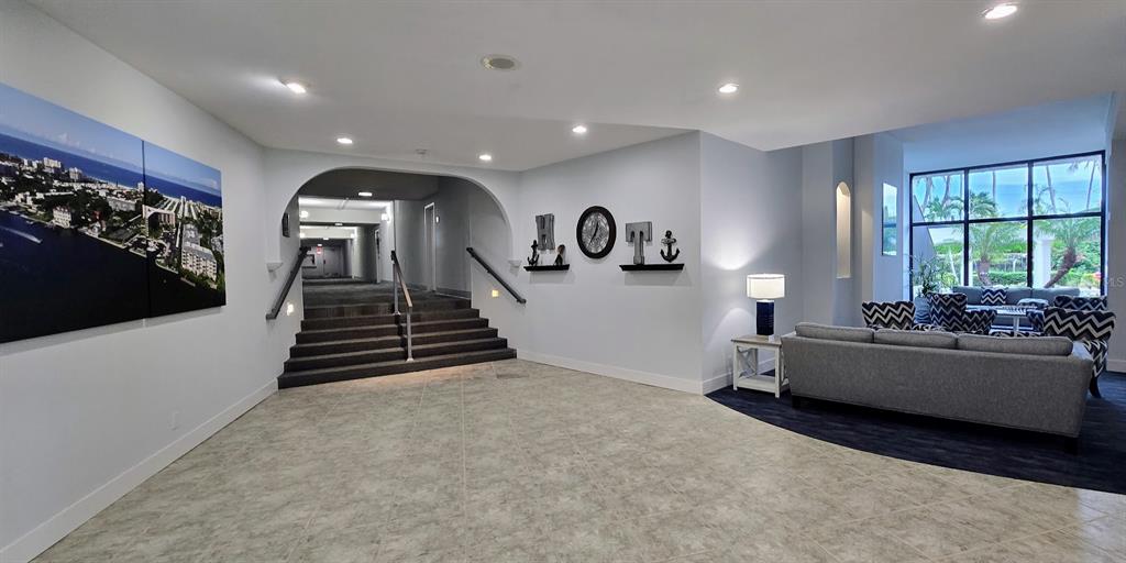 5855 Midnight Pass Road, Unit 314 Sarasota, FL 34242 - Photo 37 of 58 a living room with furniture and a large window