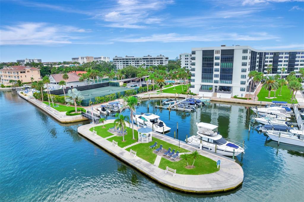 5855 Midnight Pass Road, Unit 314 Sarasota, FL 34242 - Photo 4 of 58 a view of a swimming pool with outdoor seating