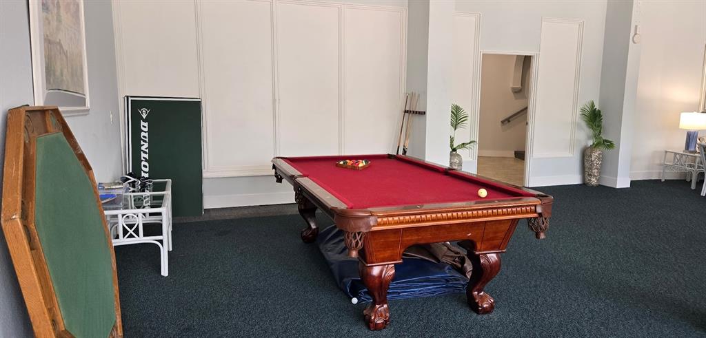 5855 Midnight Pass Road, Unit 314 Sarasota, FL 34242 - Photo 42 of 58 a room with furniture pool table and windows