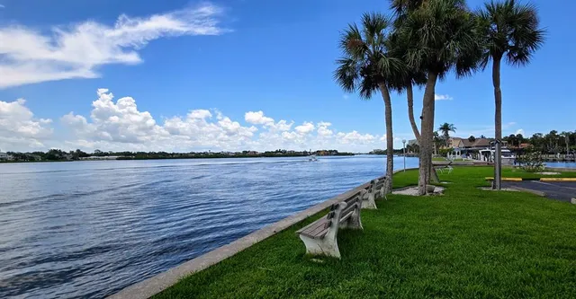 a view of a swimming pool with an outdoor seating