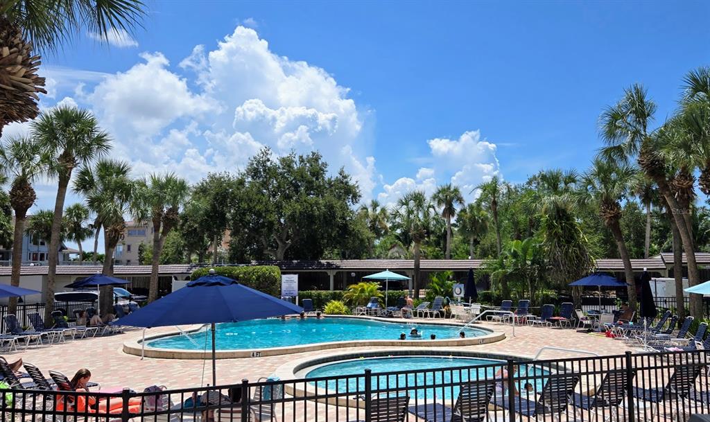 5855 Midnight Pass Road, Unit 314 Sarasota, FL 34242 - Photo 6 of 58 a view of street with seating area and barbeque oven