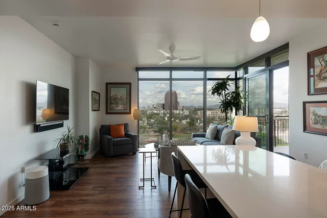 a living room with furniture and a large window