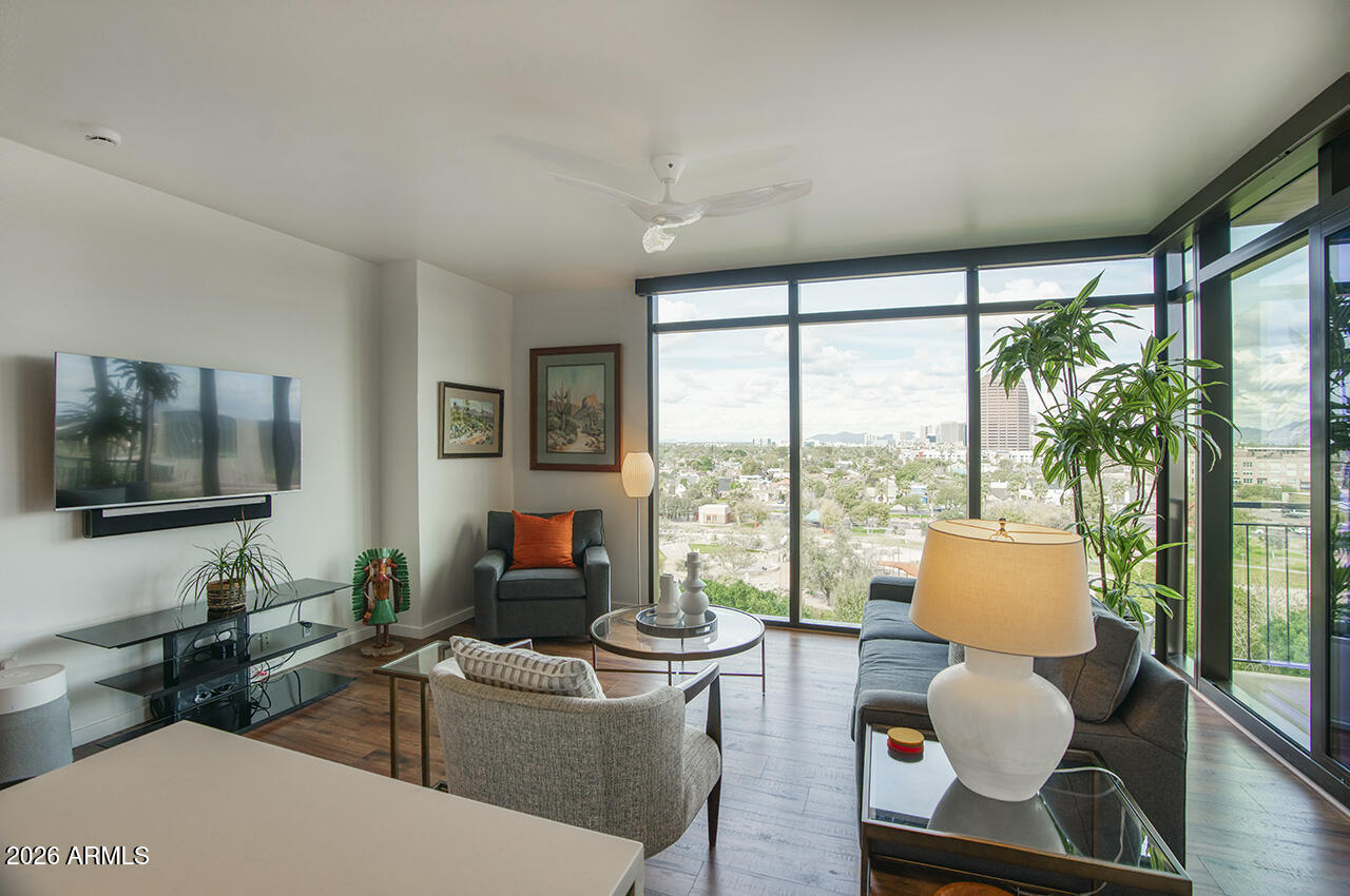 200 West Portland Street, Unit 822 Phoenix, AZ 85003 - Photo 13 of 61 a living room with furniture and a flat screen tv