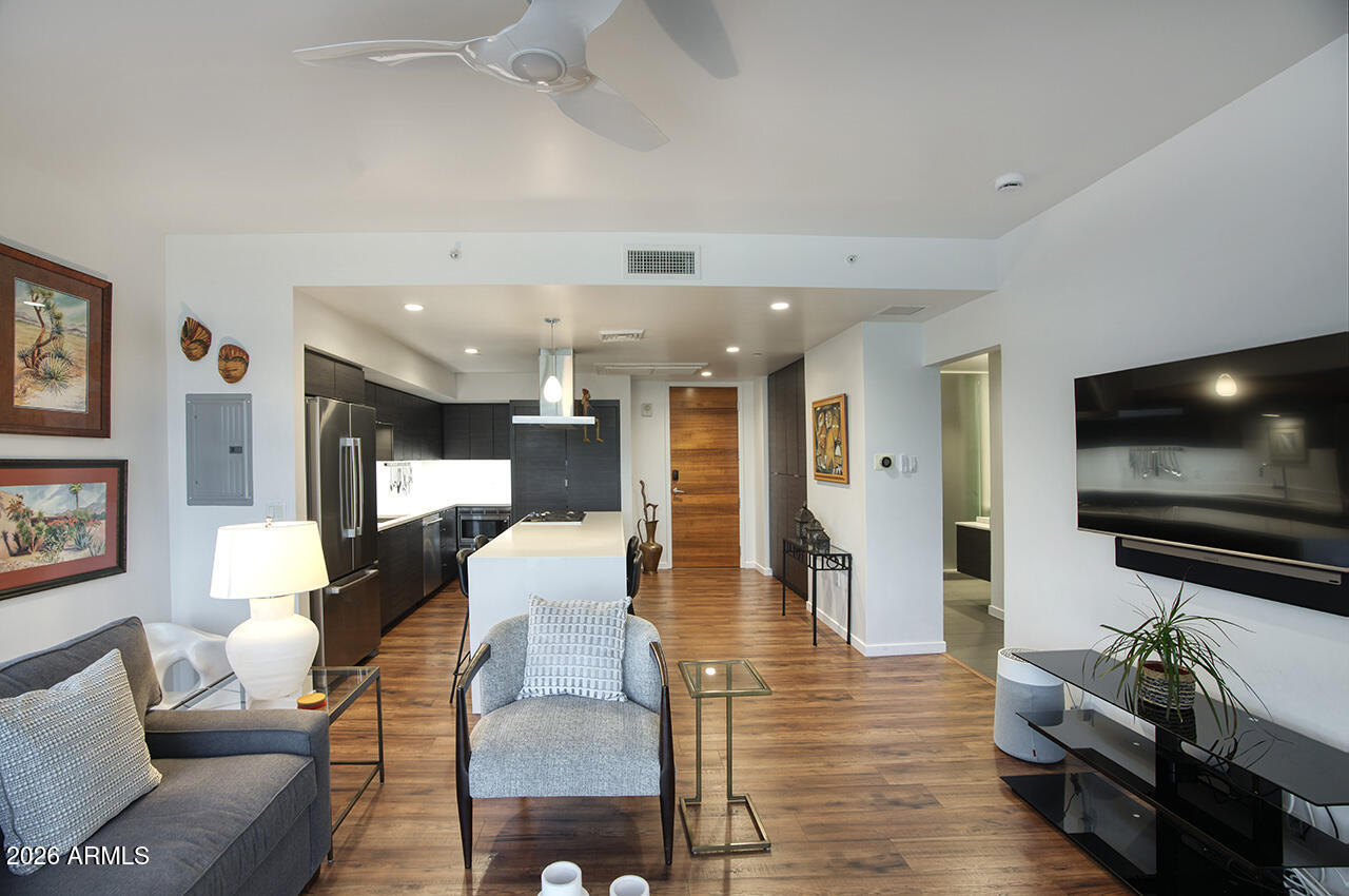 200 West Portland Street, Unit 822 Phoenix, AZ 85003 - Photo 15 of 61 a living room with furniture and a flat screen tv