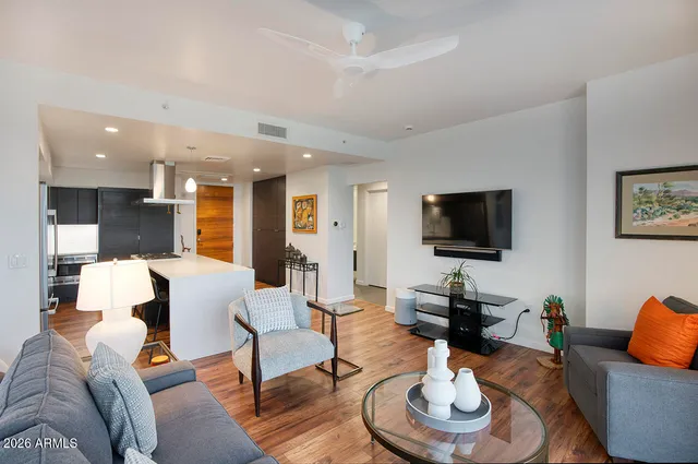 a view of balcony with furniture and potted plants